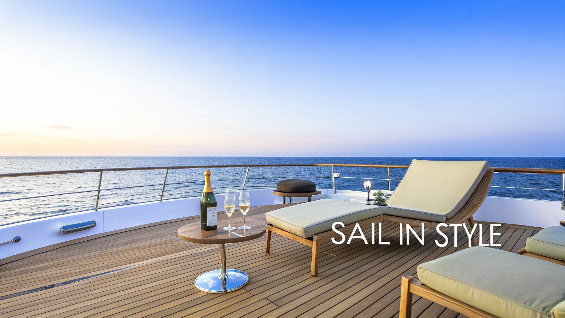 A luxurious yacht deck at sunset with champagne, glasses, and lounge chairs overlooking the vast ocean.