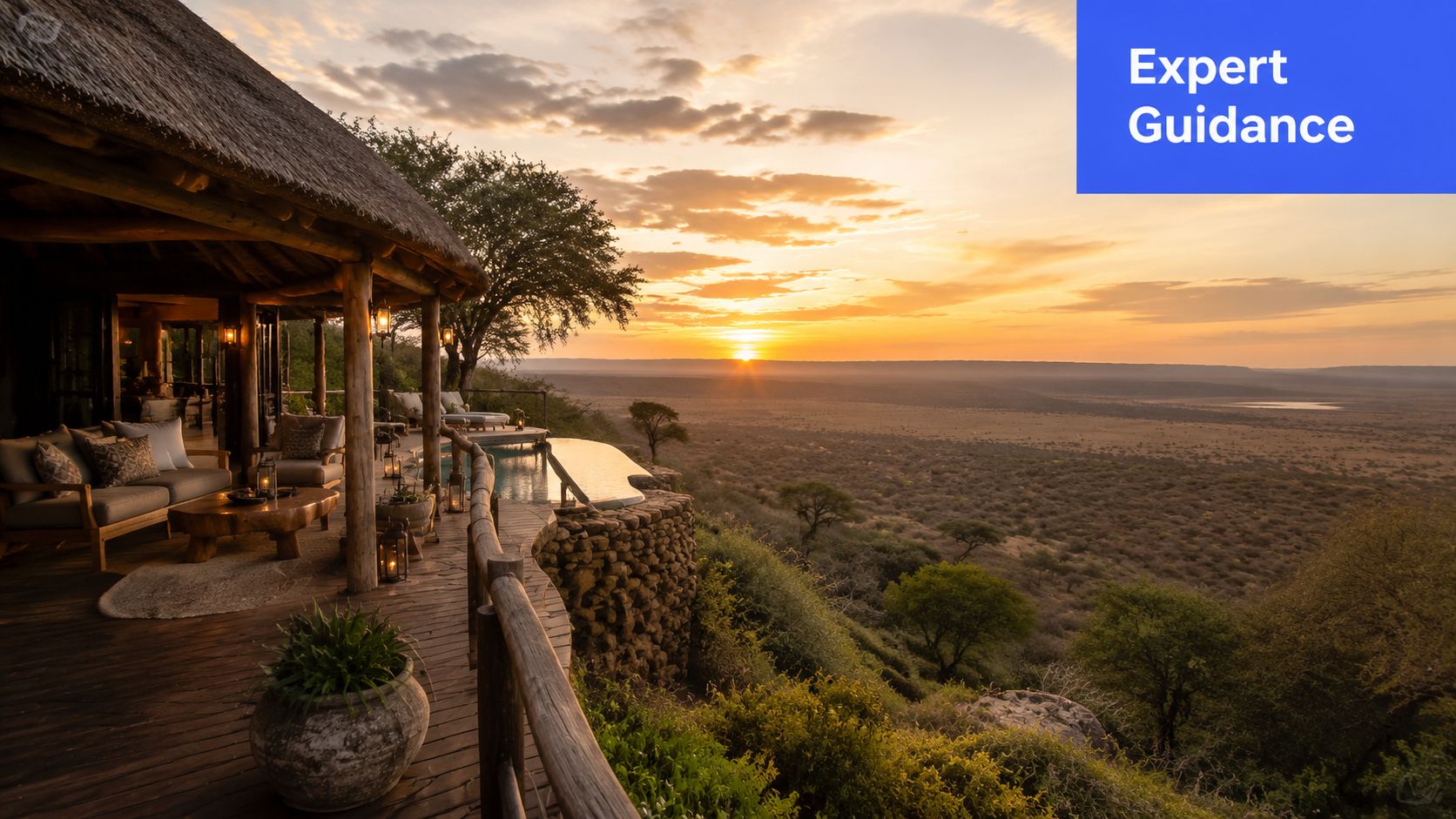 A luxurious safari lodge terrace overlooking a vast savanna landscape during a golden African sunset.