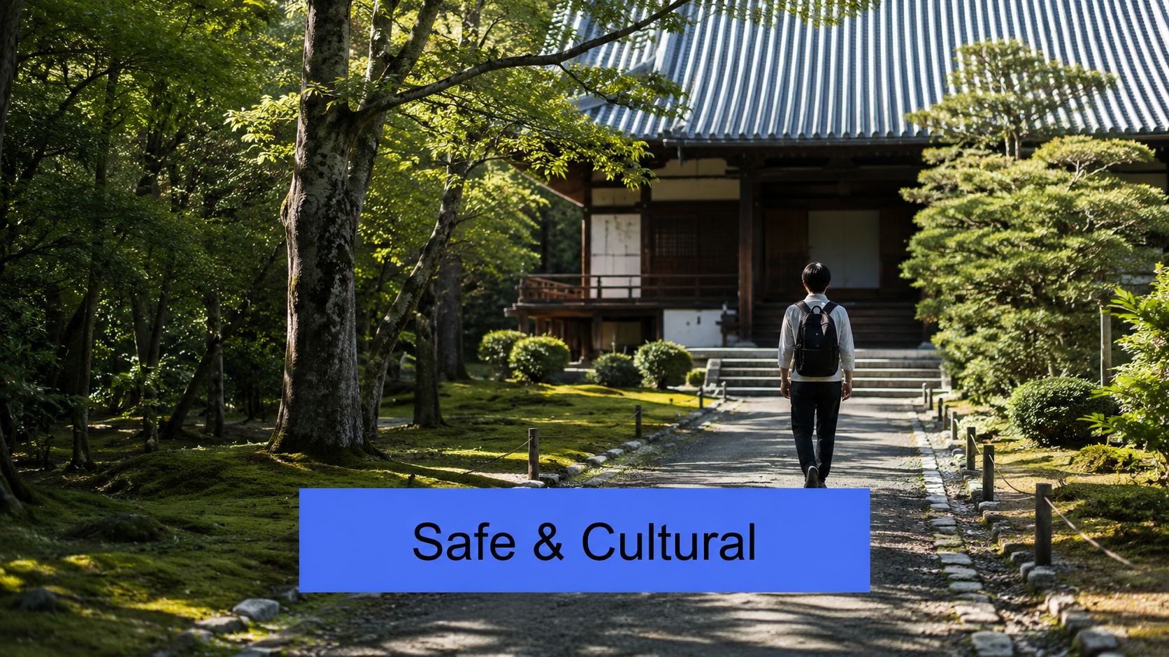 A person with a backpack walks on a gravel path toward a traditional Japanese temple surrounded by greenery.