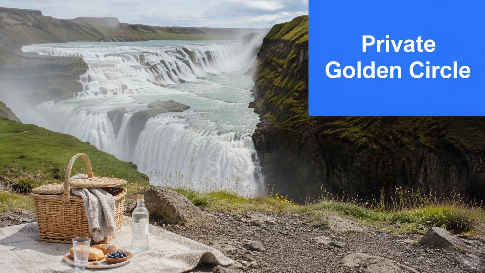 A picnic basket and snacks on a blanket overlooking the powerful Gullfoss waterfall in Iceland.