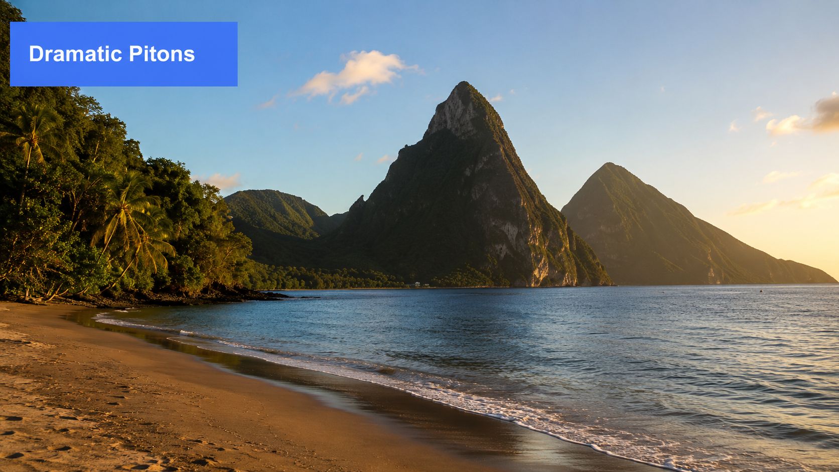 The iconic Piton mountains rise majestically from the tranquil turquoise Caribbean sea near a tropical sandy beach.