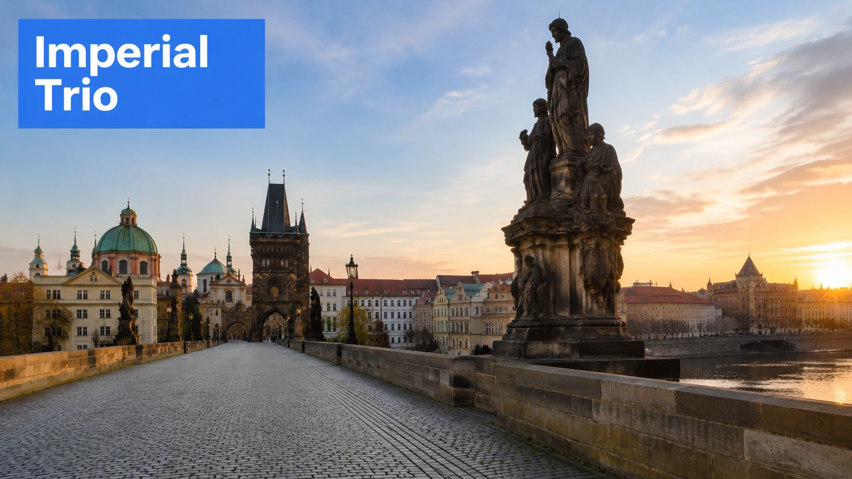 A scenic view of the Charles Bridge in Prague at sunrise with historic statues and architecture.