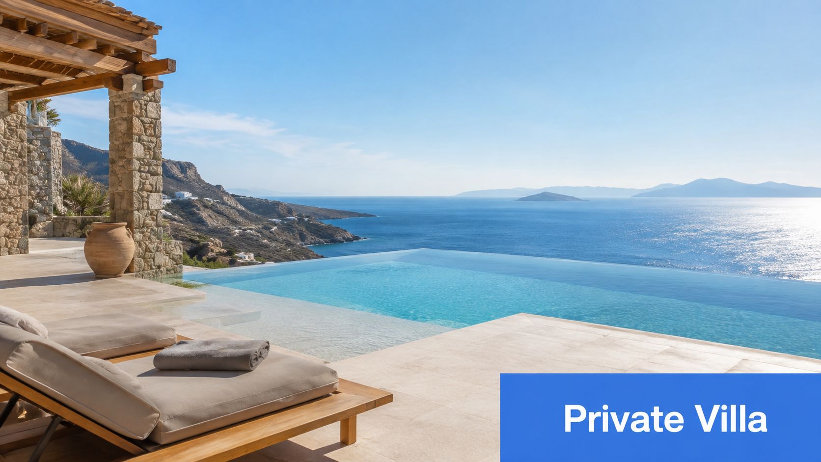 A serene infinity pool overlooking the ocean at a luxurious private villa during a sunny day.