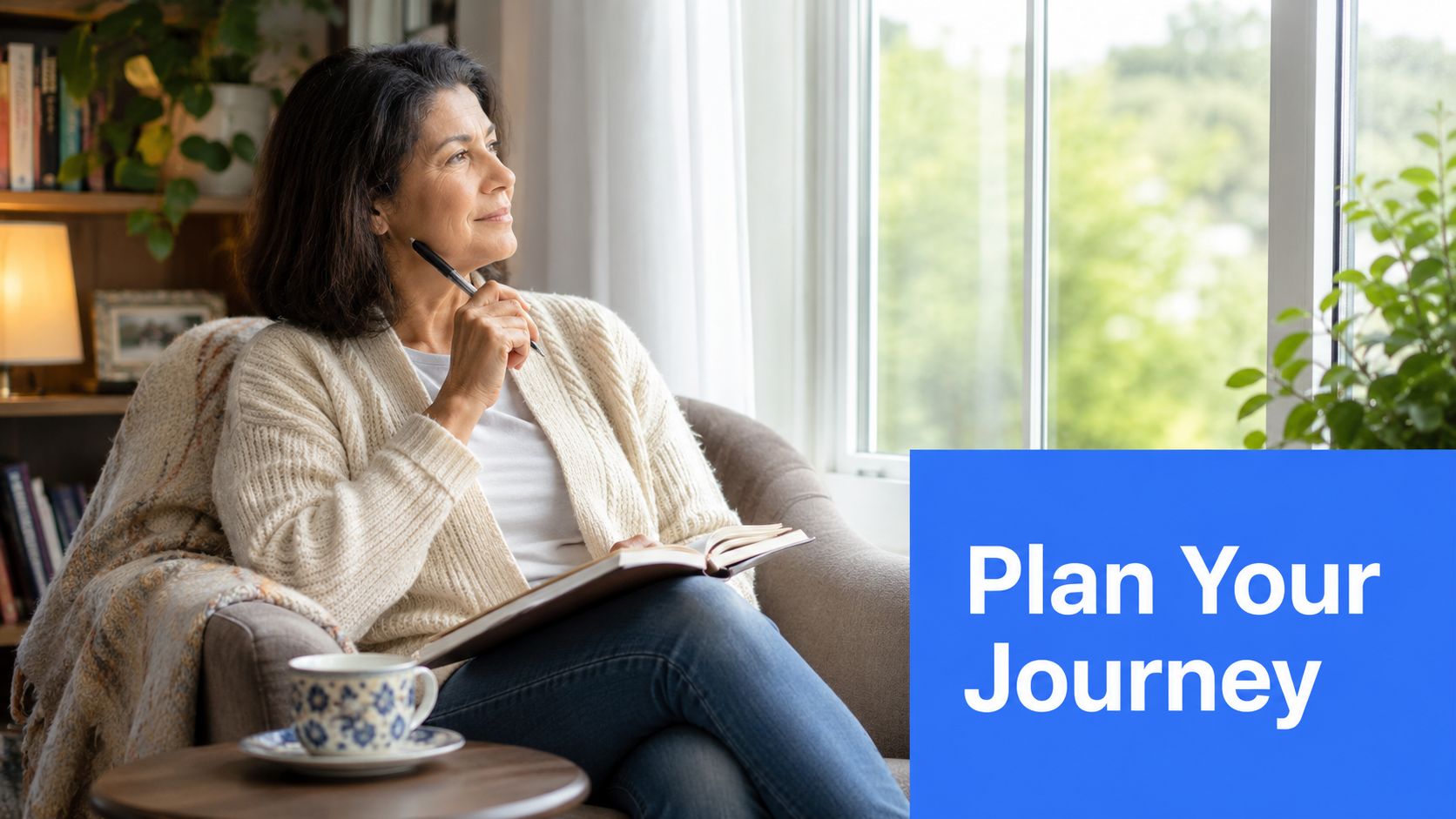 A woman sitting in a chair by a window, writing in a journal and thoughtfully planning travel.
