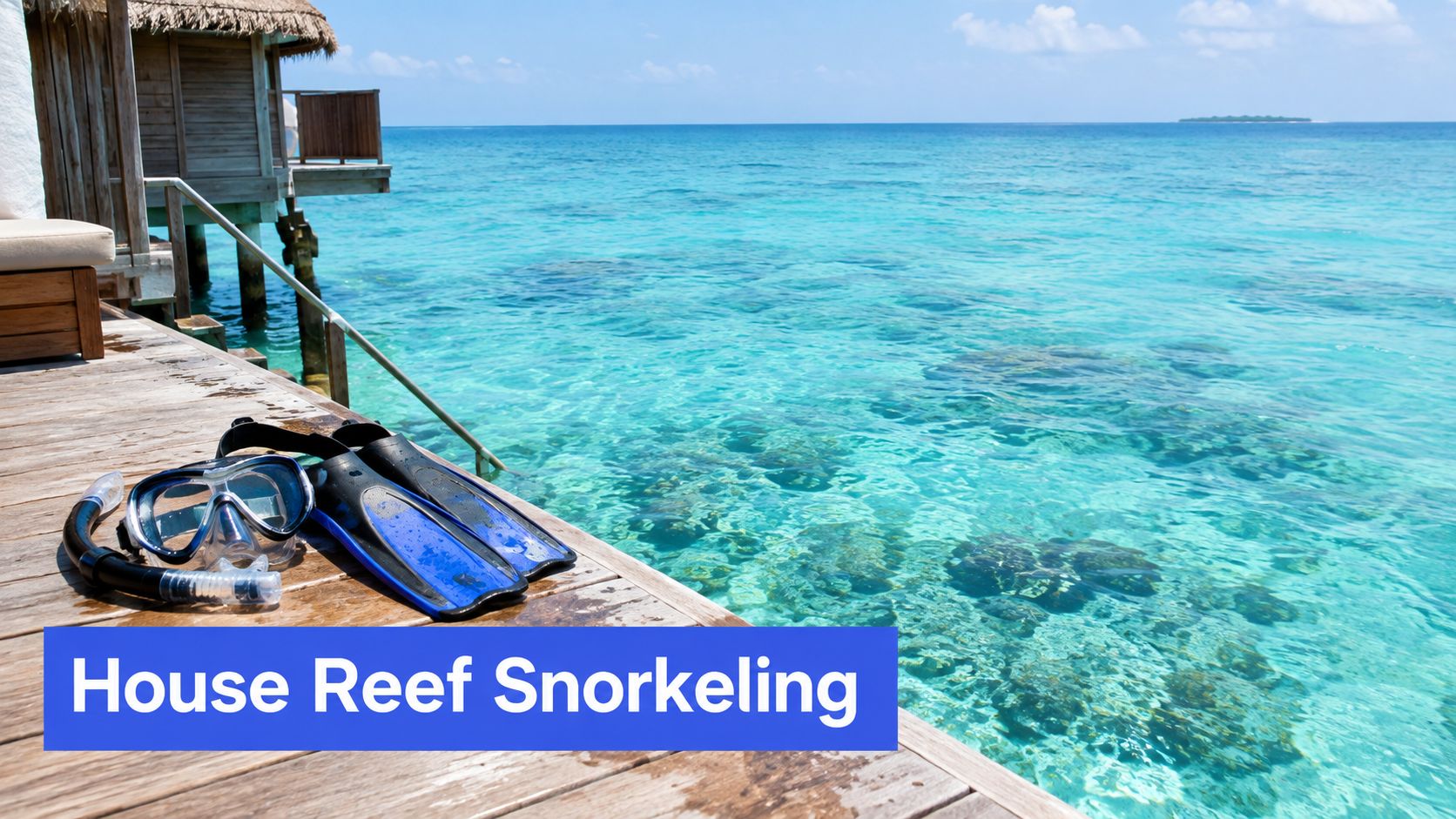 A snorkel mask and blue fins resting on a wooden deck overlooking a crystal clear ocean.